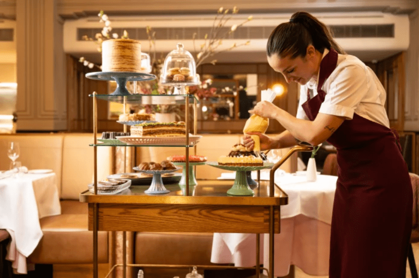 Aqualand-Etymon Projects-The Charles-Pastry chef Rhiann Mead piping teardrops of mascarpone onto her tiramisu.